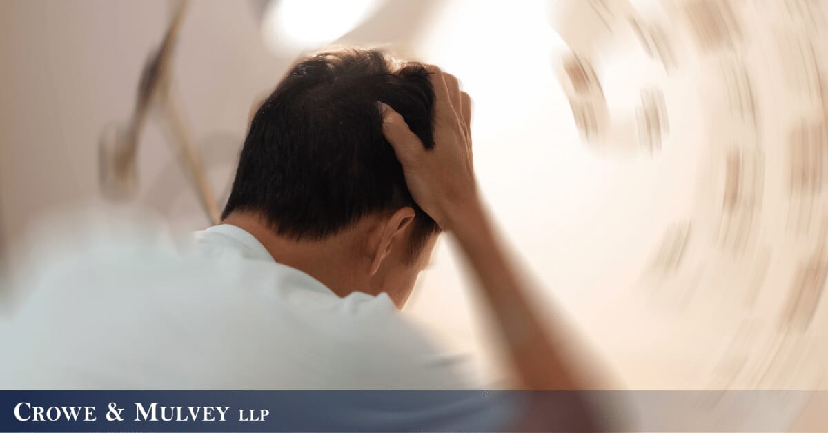man experiencing a headache